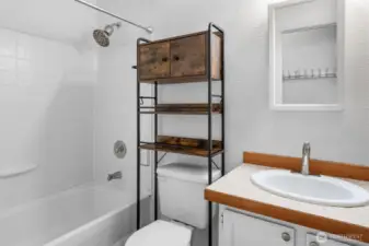 The main bathroom includes a shower, tub, and thoughtful updates.