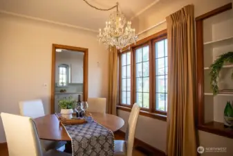 Dining room with original leaded glass window and built in shelving