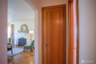 Hall closet with original door and vintage hardware