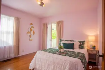 Main bedroom with door out to deck