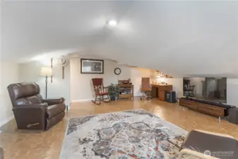 Very large storage closet in corner by desk.