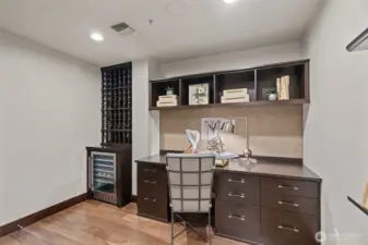 Den with built in desk and storage. Plus wine rack and fridge.