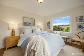 Primary bedroom with water view.