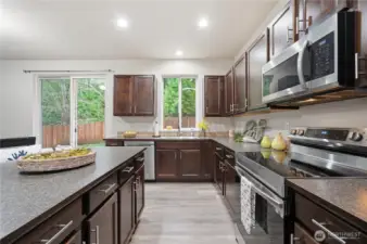 Spacious kitchen that looks out back with large island