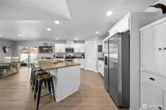 Kitchen with quartz countertops- all of the appliances stay!