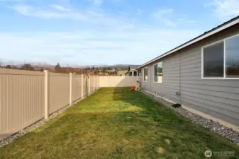 Low maintenance, fully fenced backyard.