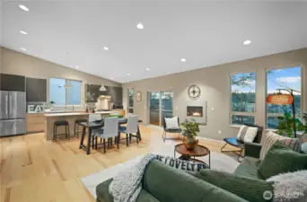 Looking to the right of the kitchen you can see the wall of western windows providing warm light and a sweeping view across the valley below.