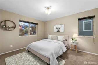 This guest room is comfortable and spacious with room for a king or queen bed and two night stands.