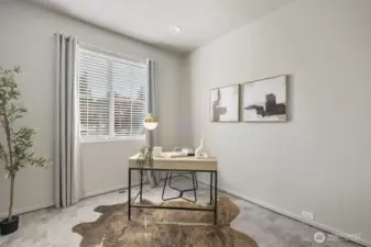 Bedroom on main floor staged as office.