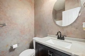 3/4 bath downstairs by bedroom staged as an office.