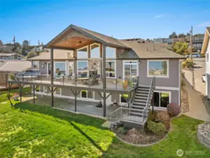 Large, composite deck partially covered to enjoy year-round