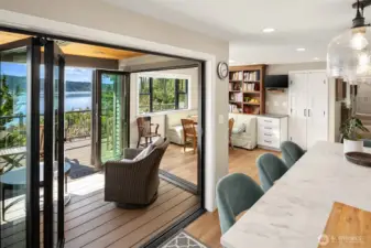 Dual NanaWall doors to a covered, heated deck – with stunning views - perfect for outdoor dining/lounging.