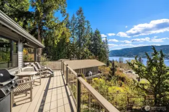 Dual NanaWall doors to a covered, heated deck – with stunning views - perfect for outdoor dining/lounging.