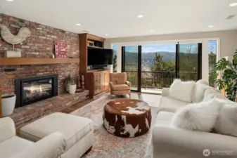 A perfect setup for extended family or guests downstairs with a Brand new, second, full kitchen with custom cherry cabinets. Large double recreation room with a gas fireplace, built-ins, with two desks-perfect for kids & homework. Huge laundry room. Relaxing steam shower. Double doors to lower decks.