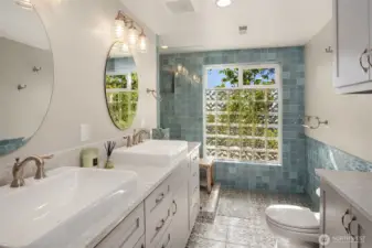 3/4 bath with Quartz counters, double sinks and heated tile floor complete the lower level.