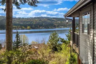 The lower level deck leads to beautiful, lush landscaping, a greenhouse, raised beds, garden shed and covered storage ~ certain to inspire any green thumb, lawn space great for pets & play that completes a serene and usable outdoor space.