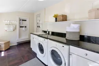 Large laundry room/mudroom with lots of storage and natural light.