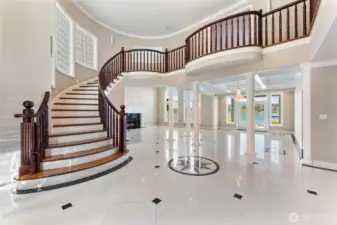 First impressions matter.  Grand spiral staircase and soaring ceilings welcome you in style.