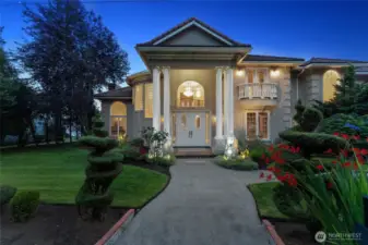 Grand curb appeal! Lush landscaping, and architectural drama-this home makes a powerful first impression!