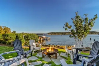 The perfect fire pit spot. Watch the sun set, roast s'mores, and gather lakeside on your own property.