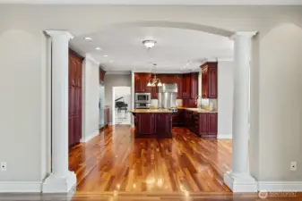 Warm hardwoods lead to a cozy dining nook with timeless charm.