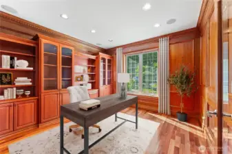 Elegant home office with custom built-ins and serene natural light. Digitally Staged