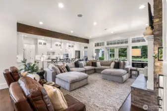 Great room opens to kitchen and breakfast nook. The french doors lead to the covered outside patio and entertainment area.