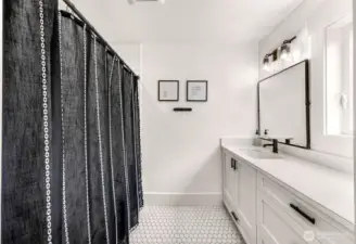 Upper bath with tub shower and 3rd vanity.