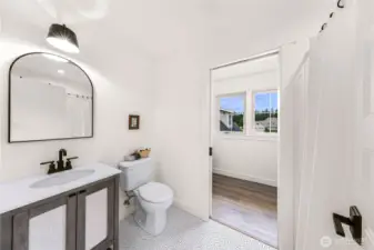 Upper full bath and walk in closet in ADU.