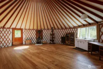 30 foot yurt makes a great common area. Sink, wood stove and propane stove.