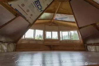Sleeping loft with dormer to bring in light.