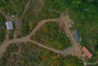 Back out to the road and to your left find the 400SF Cabin awaiting your finishing touches and tiny house.