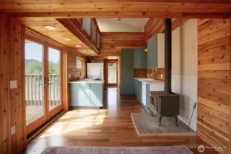 looking back from living room to entry, doors to deck on the left.