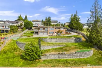 Expansive yard with terraced areas and lots of space for entertaining and relaxing