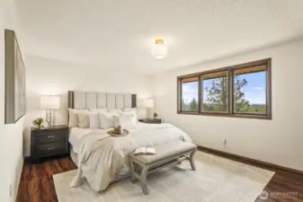 Primary suite is large and overlooking the sweeping views