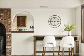 Pass through from the family room to the kitchen allows for easy morning coffee with a view