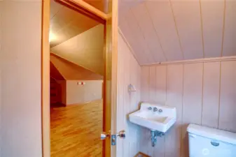 Half bathroom on upper floor just off of the bonus room.