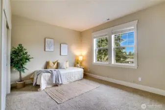 Each bedroom is roomy and bright with plenty of natural light, and the closets feature handy organizers. The fully wood-wrapped trim around the windows and closet, along with deep baseboards, adds a touch of lasting quality to the home.