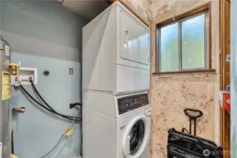 Stacking washer & dryer in the main floor bathroom, laundry combo.