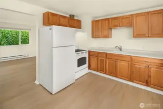 Newer appliances and ample space for kitchen dining