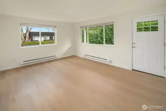 New waterproof luxury vinyl plank in living room, kitchen and hall.