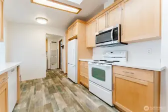 Kitchen looking towards laundry/entrance.
