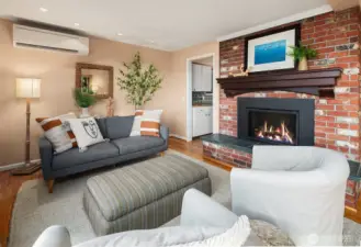 Brick fireplace and mini split provide for a comfortable living room environment.