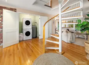 First floor laundry and hot water heater with updated interior doors/hardware.