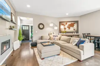 Living room features 9 ft ceilings & a gas fireplace!