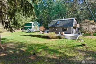 What a great yard for entertaining friends, enjoying quiet moments with nature and starting your garden. And that huge detached garage will house all the tools you'll need in order to keep your garden growing.