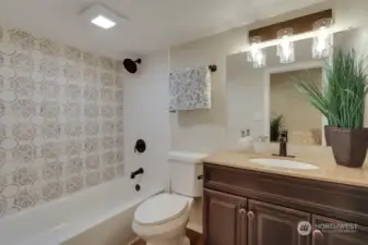 Lower Level: Full Bath #2 w/Custom Tile in the Shower, Laminate Floors and New Vanity. Gorgeous!