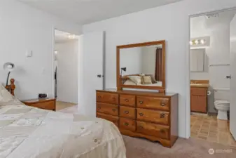 Primary bedroom with large closet and access to full bath.