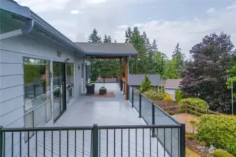 The deck spans the full length of the house, great for gathering.