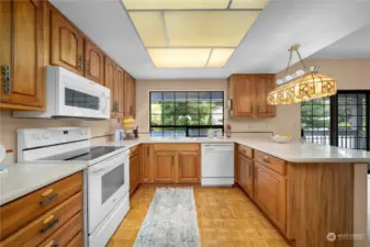 Just off the living room is the kitchen with newer cabinets and counter space.